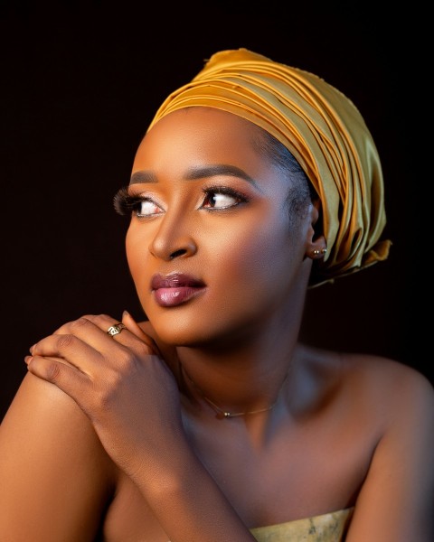 a woman with a yellow turban on her head