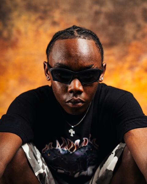 a man wearing a black shirt and sunglasses