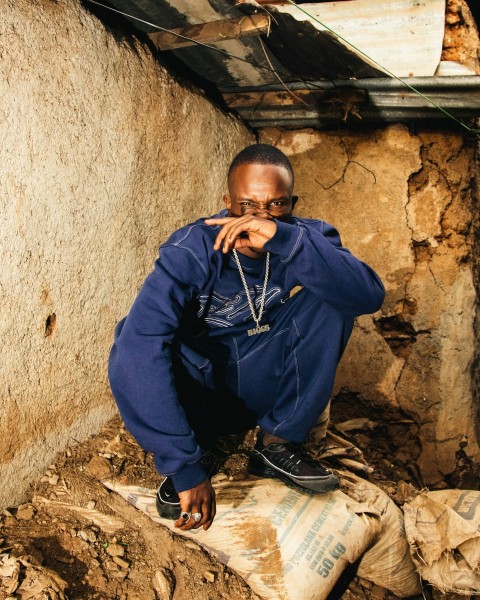 a man sitting on top of a pile of dirt