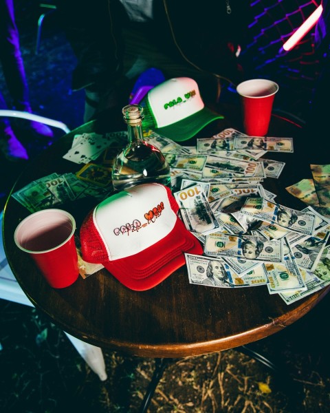 a wooden table topped with lots of money