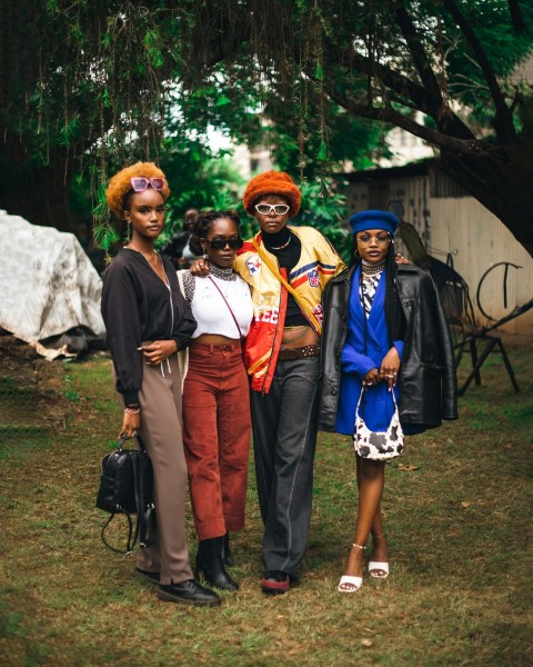 a group of people posing for a photo ZoM