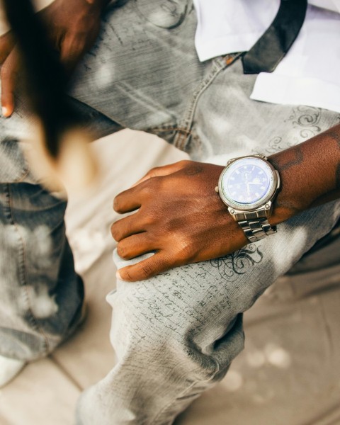 a close up of a person wearing a watch