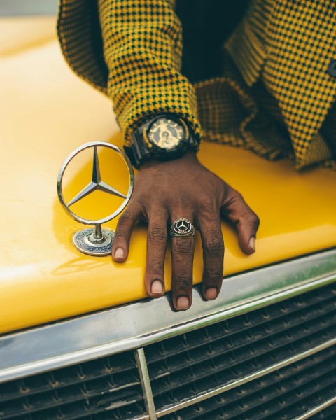 a hand holding a watch