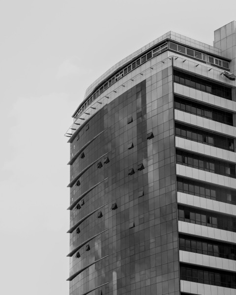 a black and white photo of a tall building