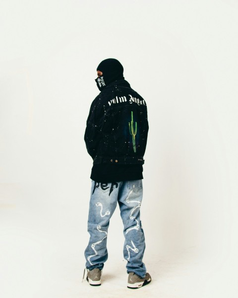 a man standing in front of a white background