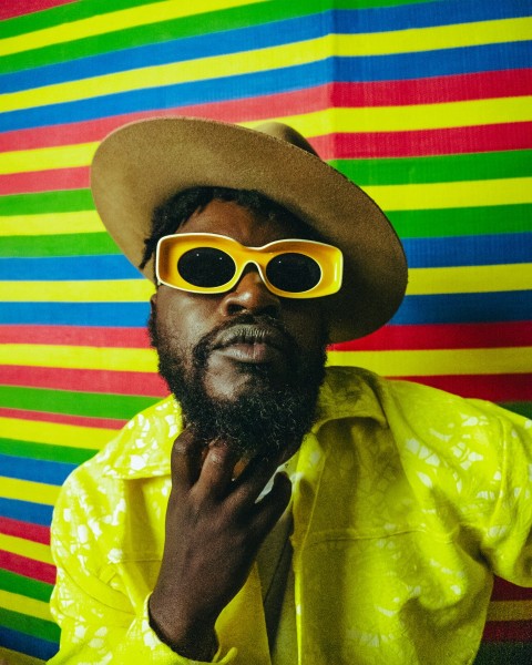 a man in a yellow shirt and yellow sunglasses