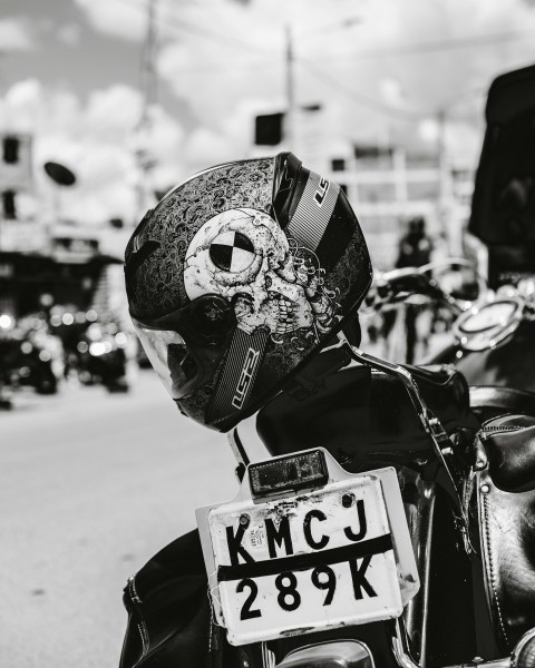 a motorcycle with a helmet on the back of it