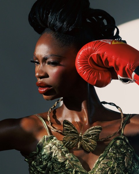 a woman with a red boxing glove on her head