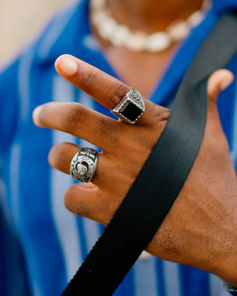 a person with a ring on their hand