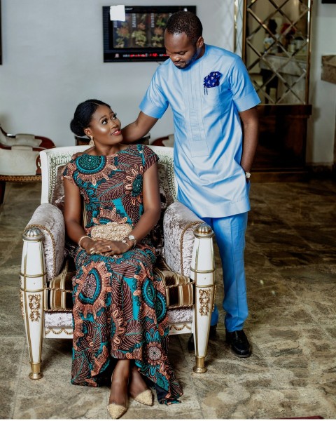 woman sitting on padded chair beside man