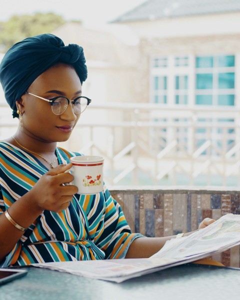 woman holding ceramic mug