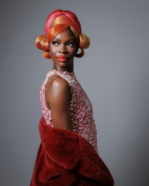 a woman wearing a red dress and a red scarf