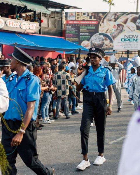 a group of police officers walking down a street