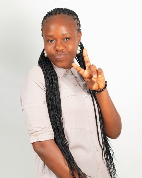 woman in white dress shirt holding black wireless telephone