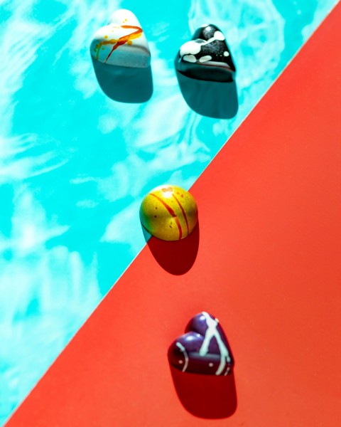 a pool with a red and blue pool cover and three balls on it