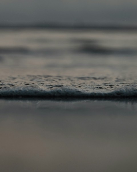 water wave on brown sand