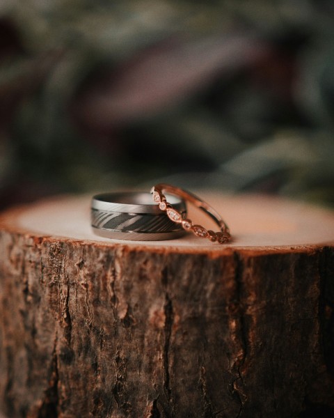 two silver color and gold color rings