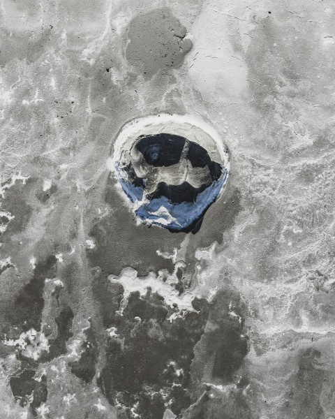 blue and white ball on white sand