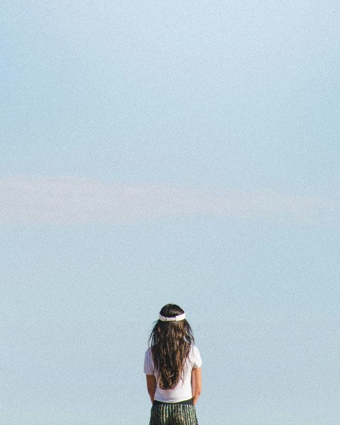 woman wears white crew neck shirt