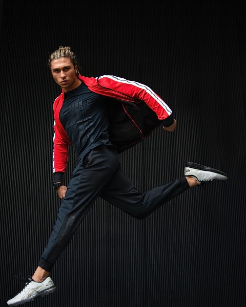 a man with a backpack is running