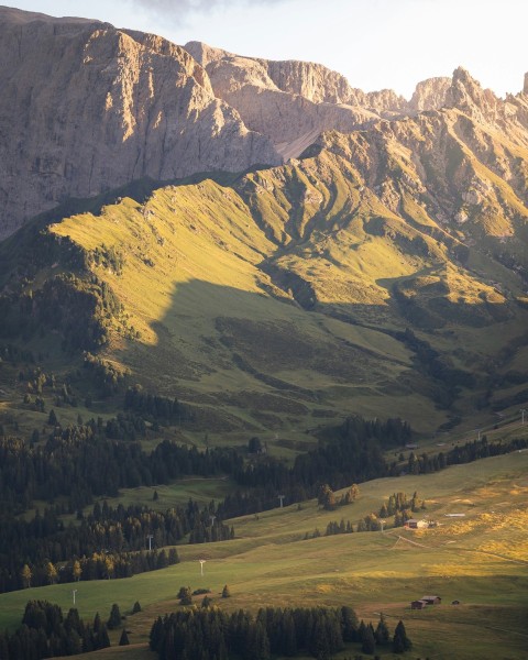 a view of a valley with mountains in the background 7gL6x