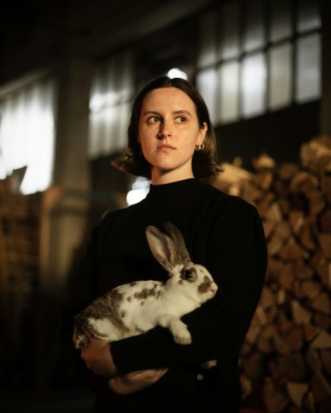 a person holding a rabbit