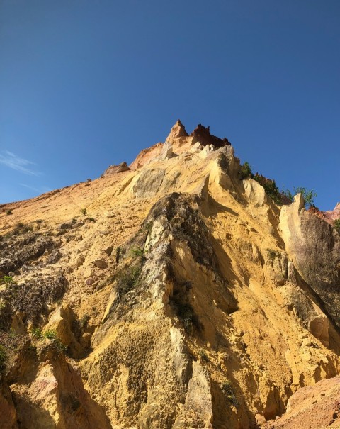 a very tall mountain with some rocks on top of it