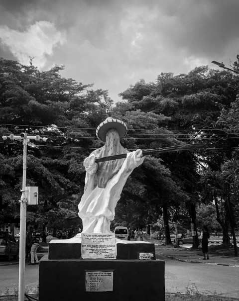 a black and white photo of a statue