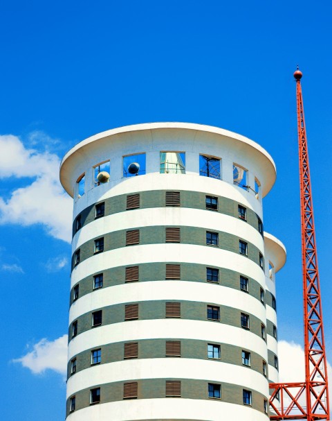 a tall building with a crane