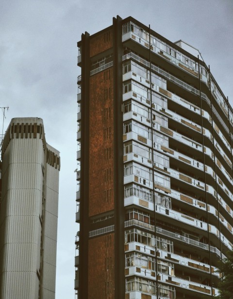 a very tall building next to a very tall building