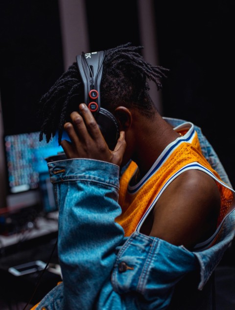 woman in blue denim jacket covering her face with her hair KOq