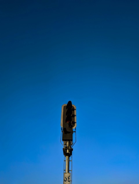 a traffic light sitting on the side of a road