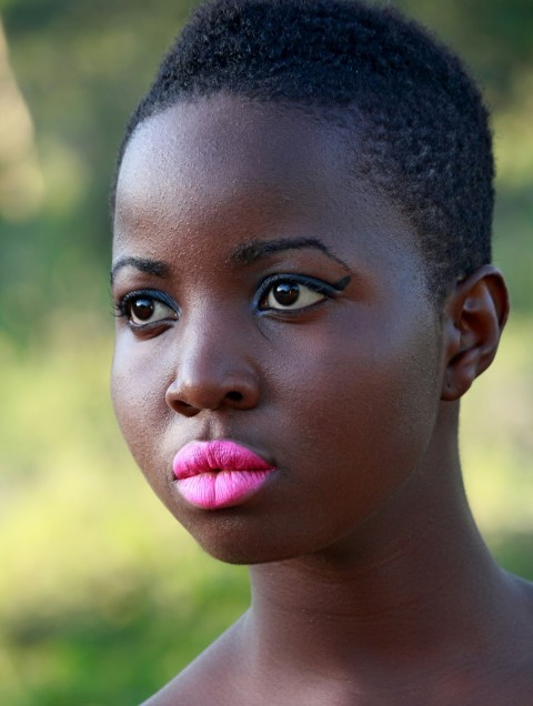 a close up of a person with a pink lipstick PuKT