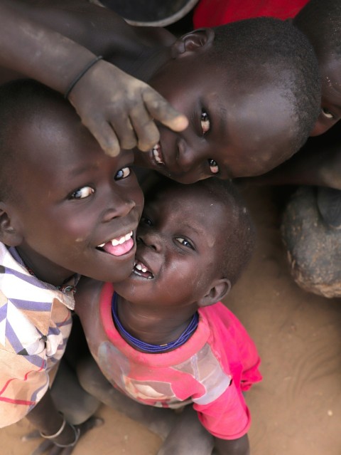 a group of young children standing next to each other