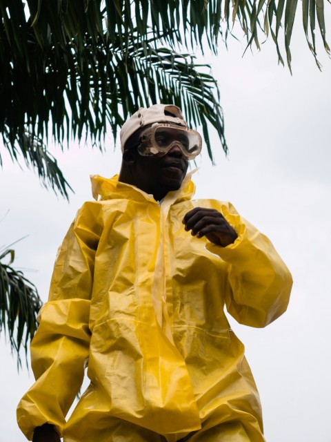 a man wearing a yellow raincoat