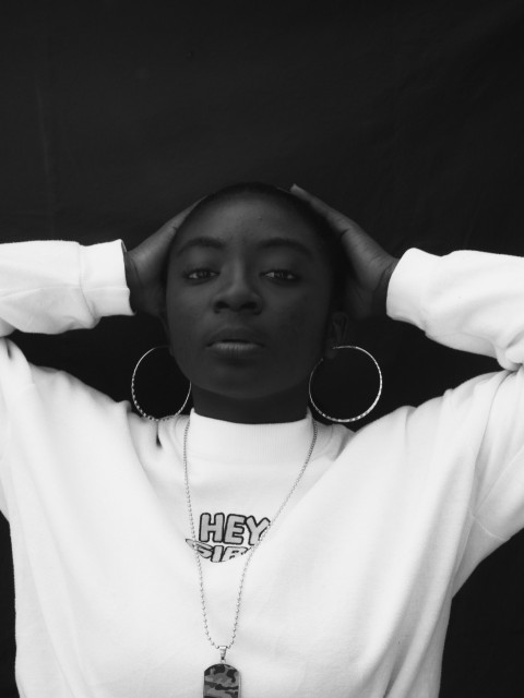 grayscale photo of woman in white long sleeve shirt