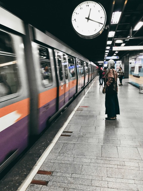 people walking on sidewalk near train fdQnYlPic