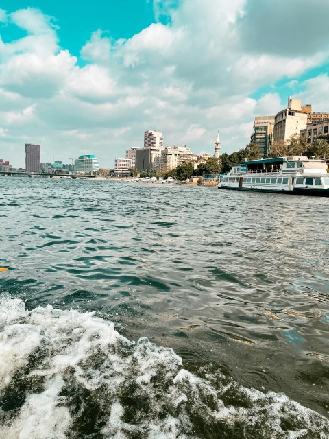 a man riding a surfboard on top of a body of water