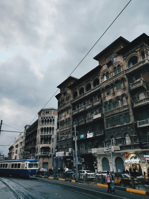 a city street with a train on the tracks