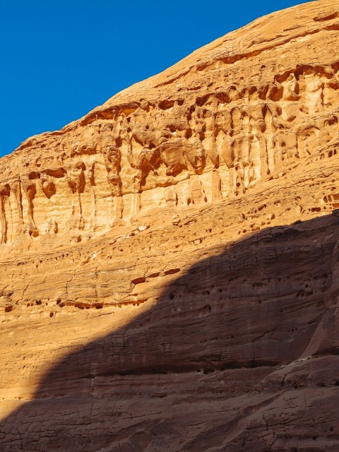 a large rock formation in the middle of a desert