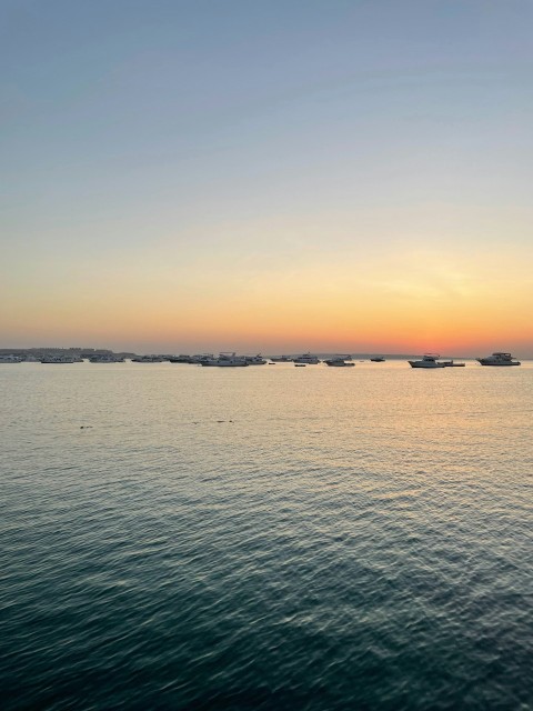 a body of water with boats in the distance