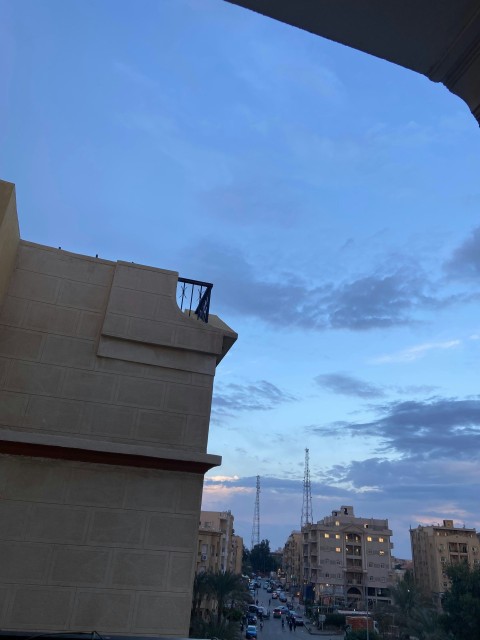 a view of a city street at dusk