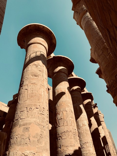 a close up of some ancient pillars