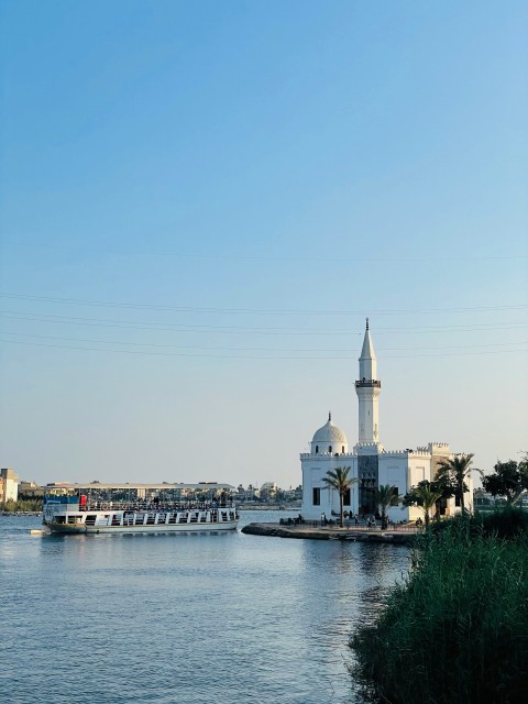 a body of water with a building in the background