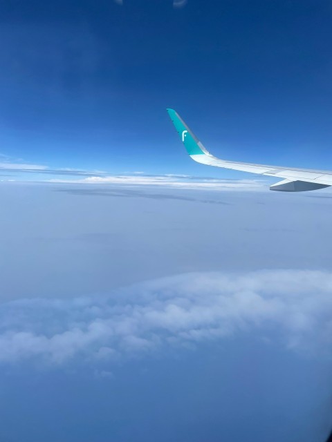 an airplane wing in the sky