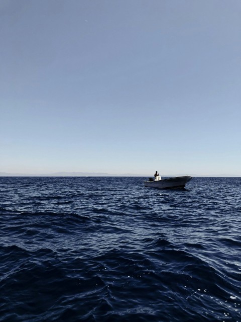 person riding on boat on sea during daytime gsnRMW