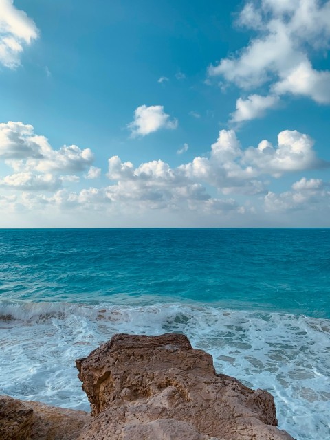 a view of the ocean from a rocky outcropping R