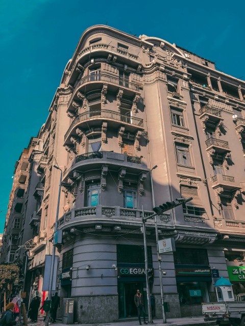 a tall building with many windows and balconies