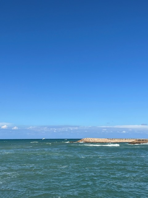 a person riding a surfboard in the ocean