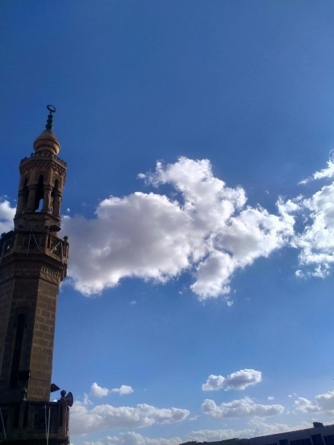 a tall tower with a clock on the top of it